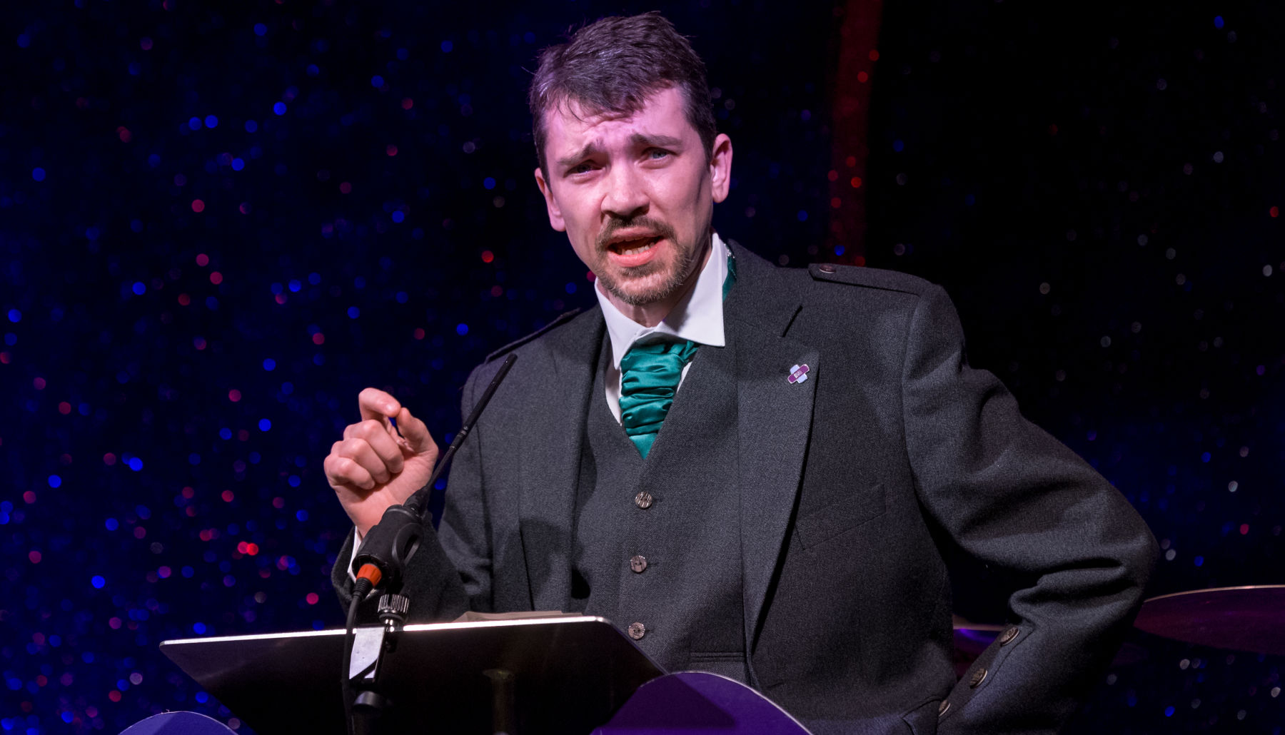 Mr Roddy O'Kane delivering a speech in front of a lectern