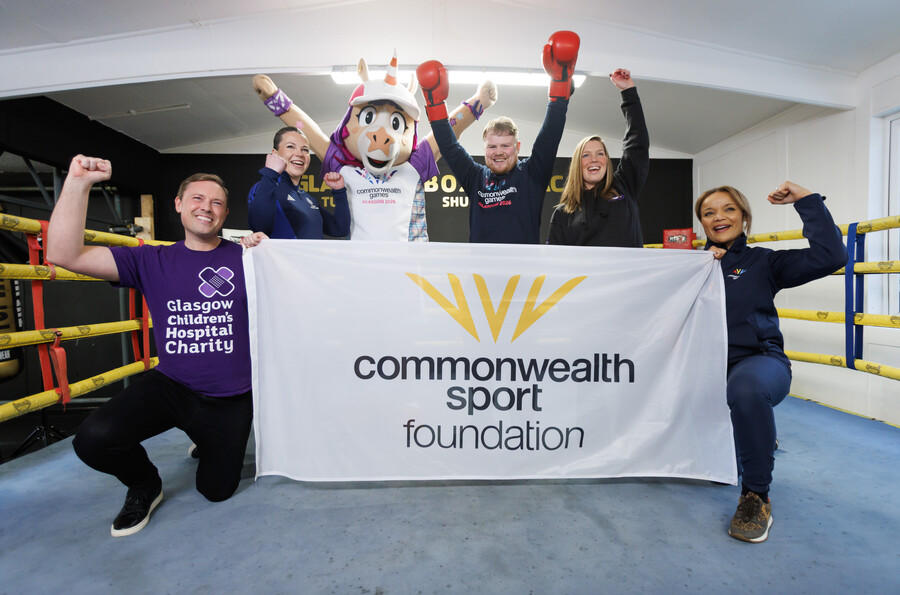 Finnie and Charlie Flynn with representatives from Glasgow 2026 charity partners