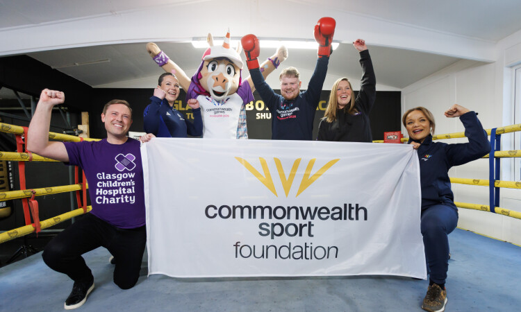 Finnie and Charlie Flynn with representatives from Glasgow 2026 charity partners